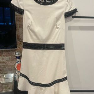 White Alice and Olivia dress with black trim. Cocktail party appropriate!